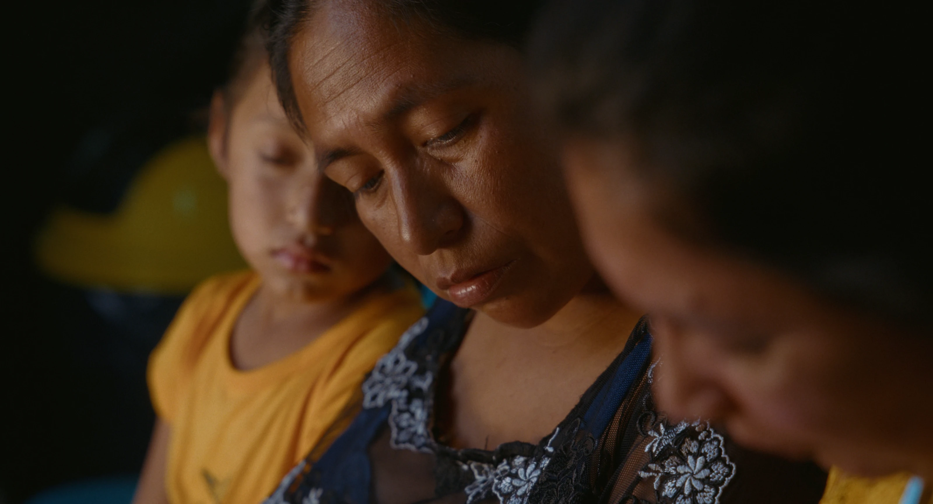 A mother and children in a quiet moment together in Guatemala.