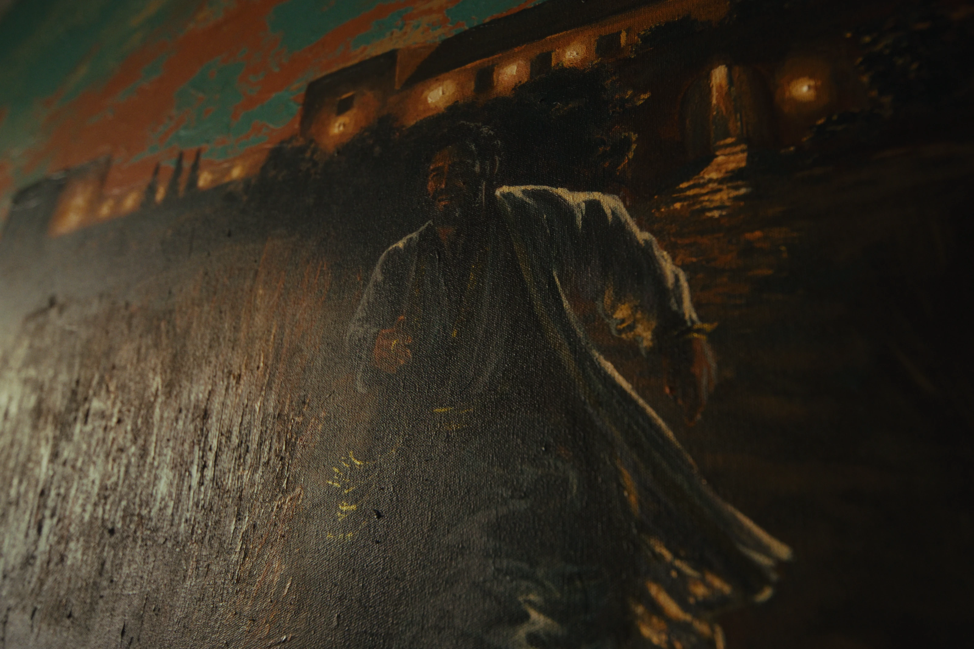 A close view of the mural’s painted figures and texture.