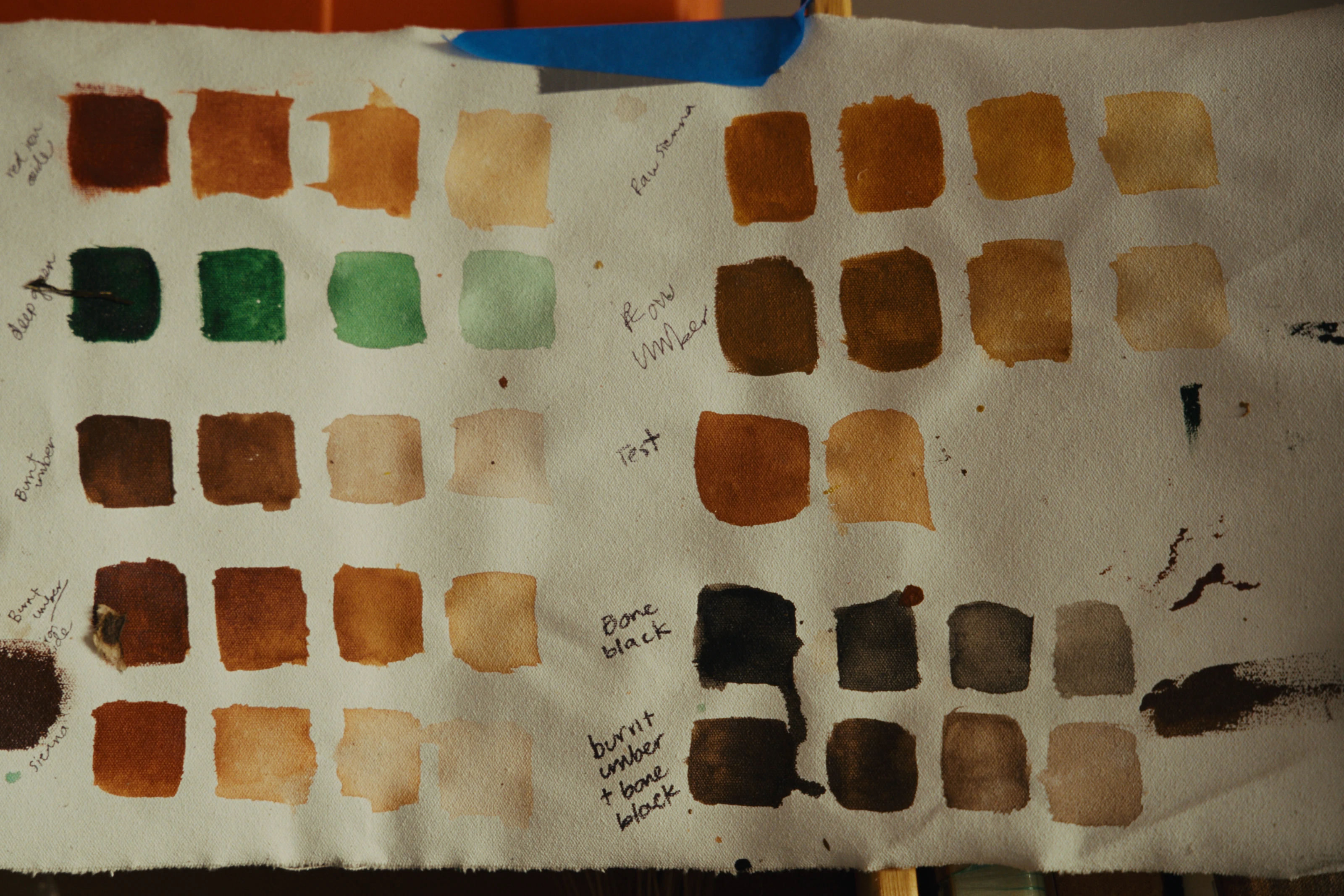 A cloth reference sheet showing painted color studies.